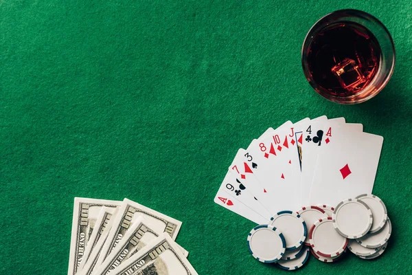Close-up of a player's Blackjack hand showing cards and betting chip on a live table